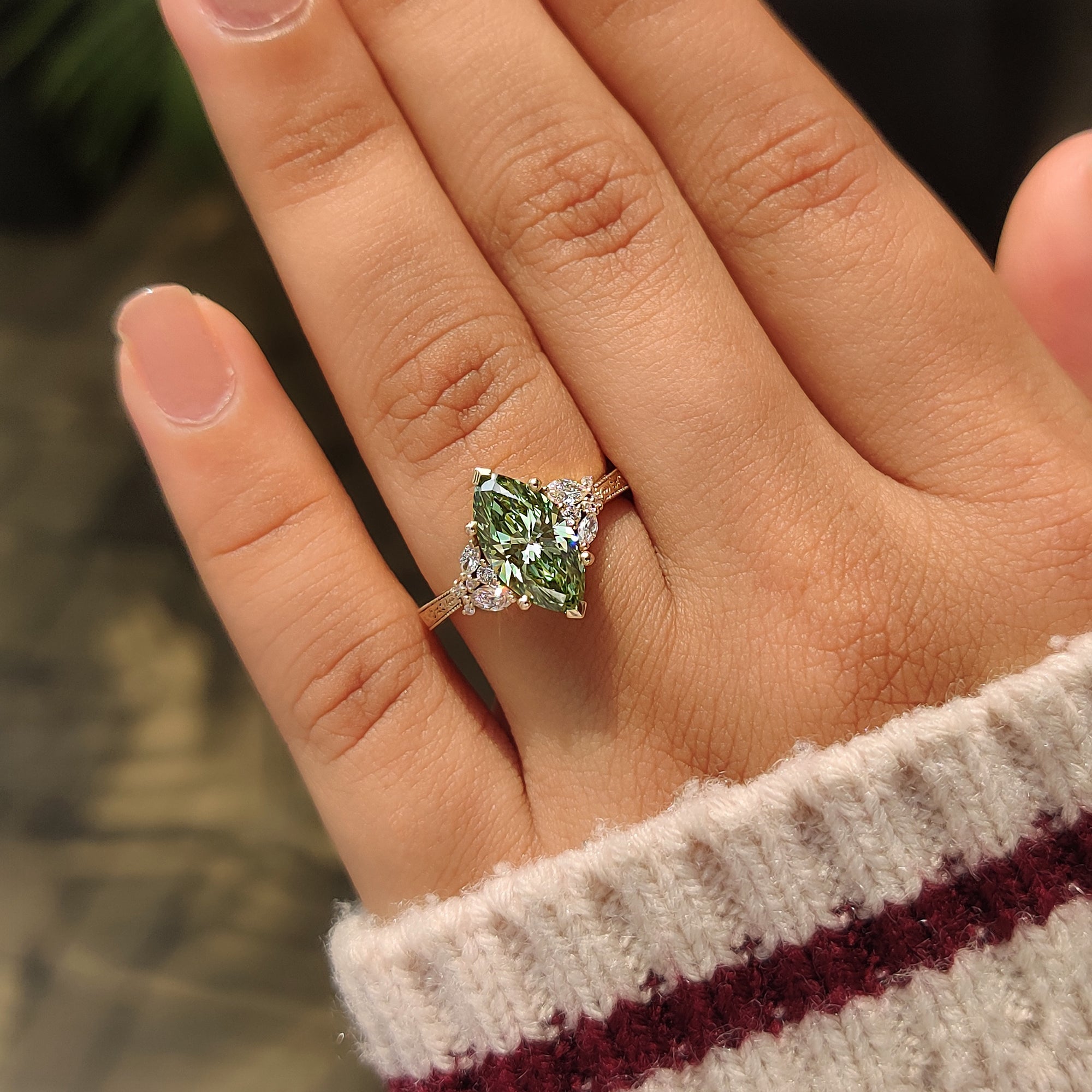 Floral band green marquise diamond ring.
