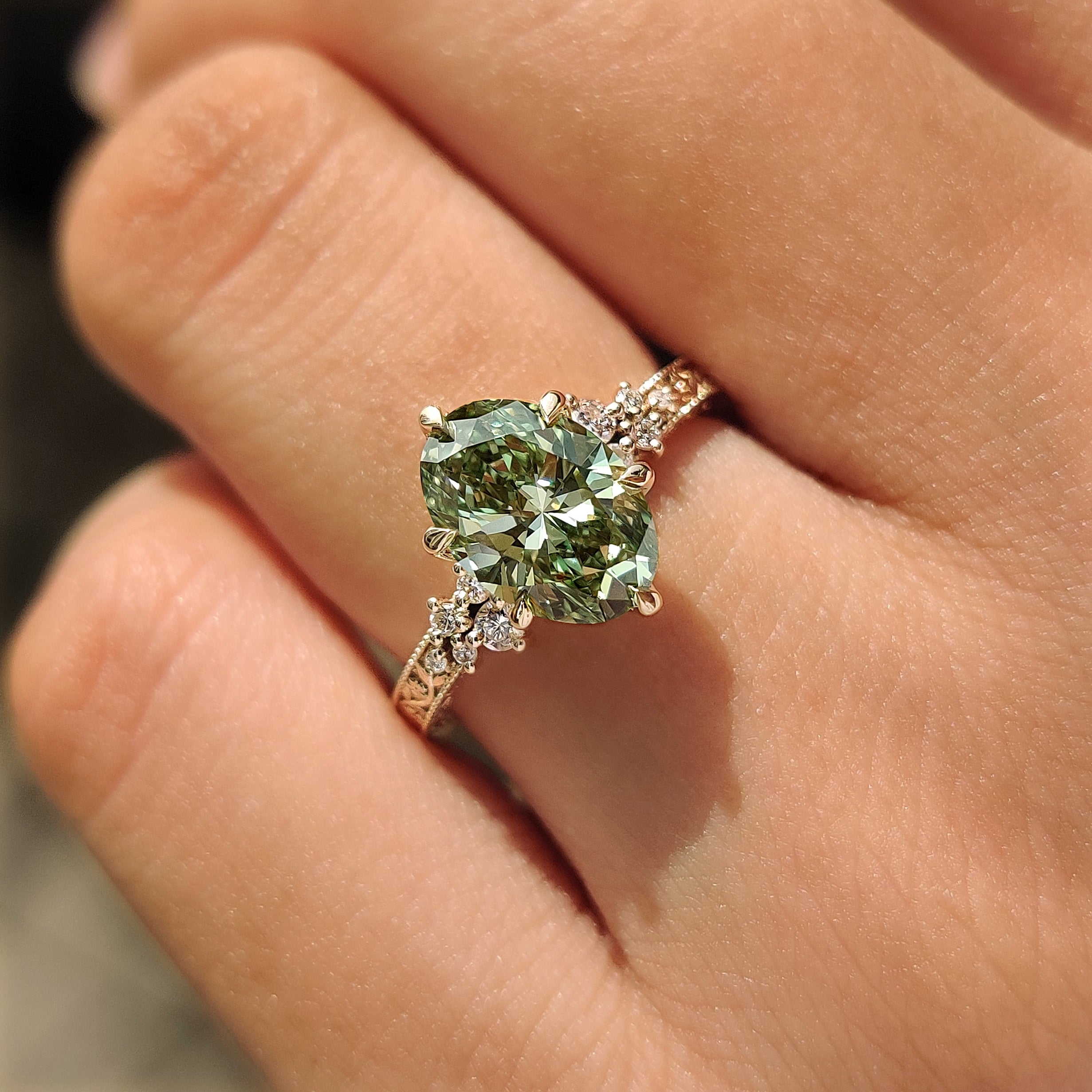 Milgrain engagement ring with green oval diamond
