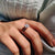 The cushion cut ring features soft, rounded edges for a graceful look.
