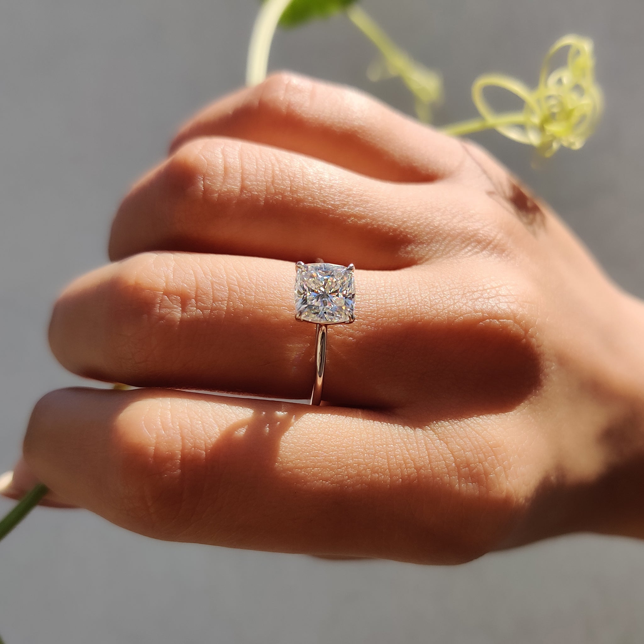 A solitaire moissanite ring shines with brilliant clarity and sparkle.
