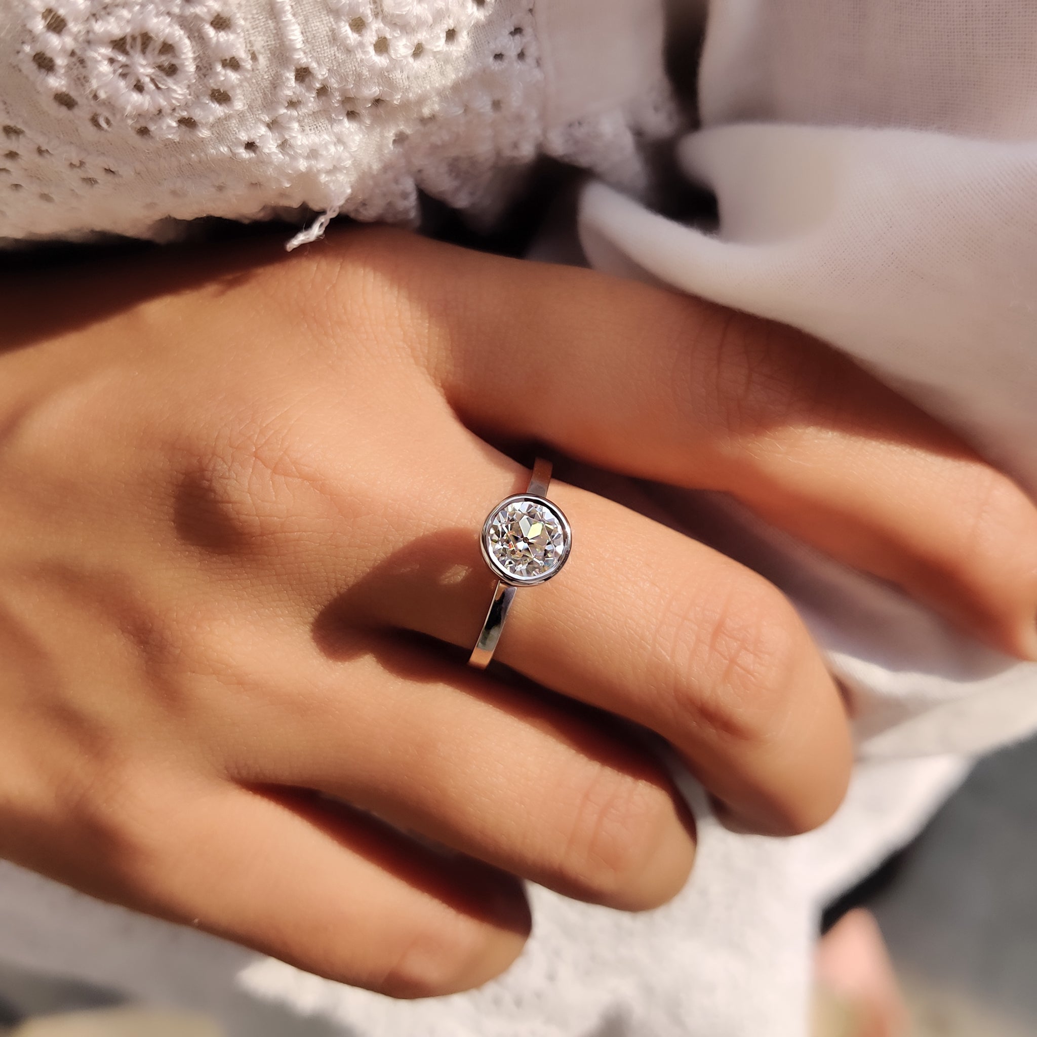 Round old European cut ring in handmade design.