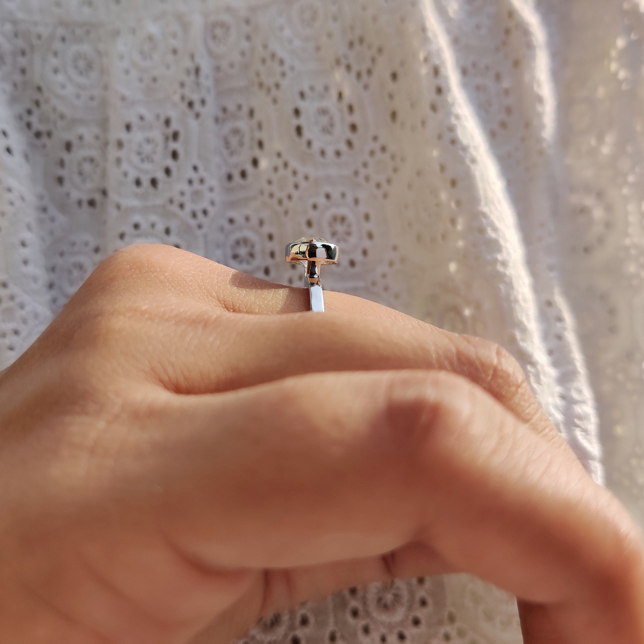 Solitaire moissanite ring in white gold by Carat Diamonds.