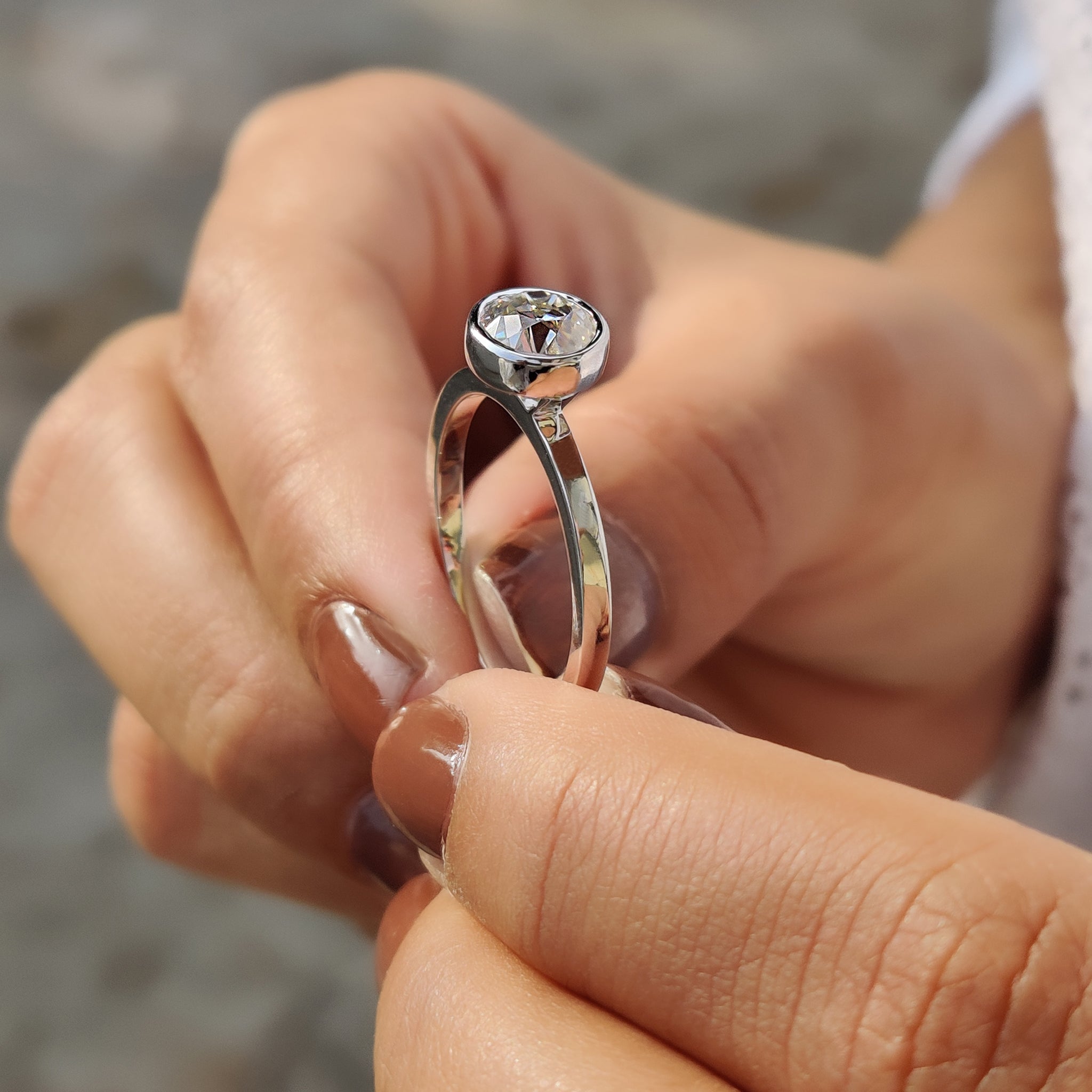 Carat Diamonds engagement ring with bezel setting.