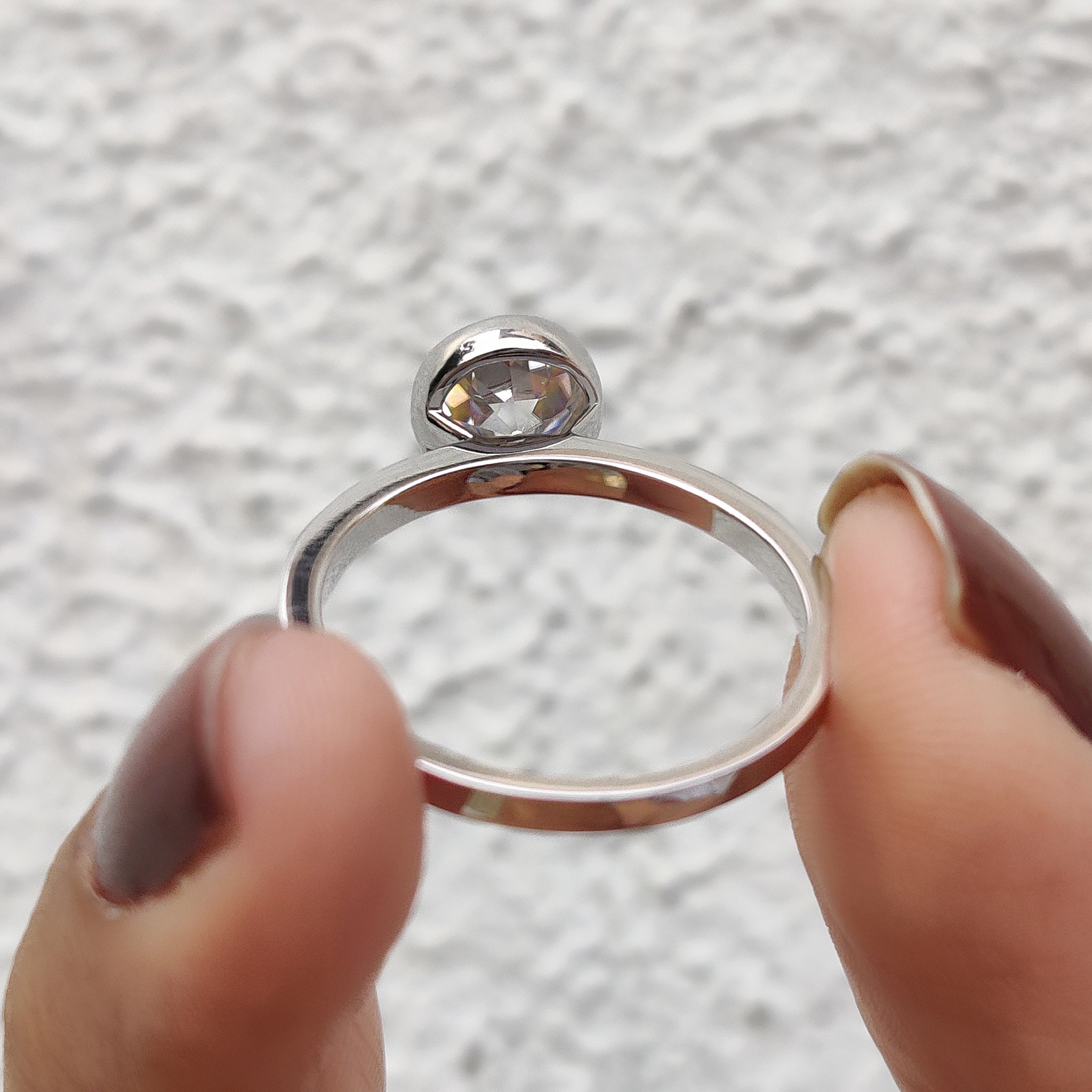 Old European cut moissanite ring in custom bezel setting.