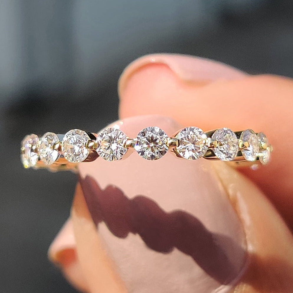 Floating Wedding Band with round cut design in yellow gold.