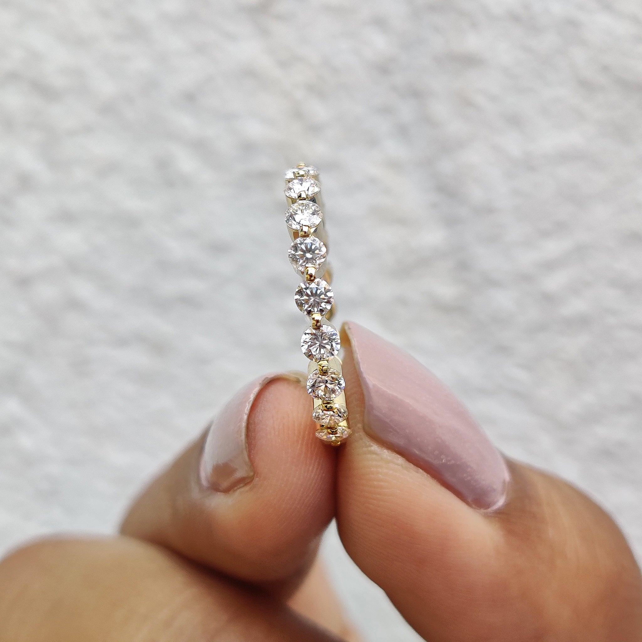 Handmade jewelry featuring a bubble prong wedding band in yellow gold.