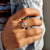 A solitaire engagement ring highlights the center stone's beauty.
