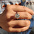 This cathedral ring features arches that frame the center stone beautifully.