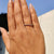 Eternity Wedding Band with sparkling Moissanite stones in yellow gold.