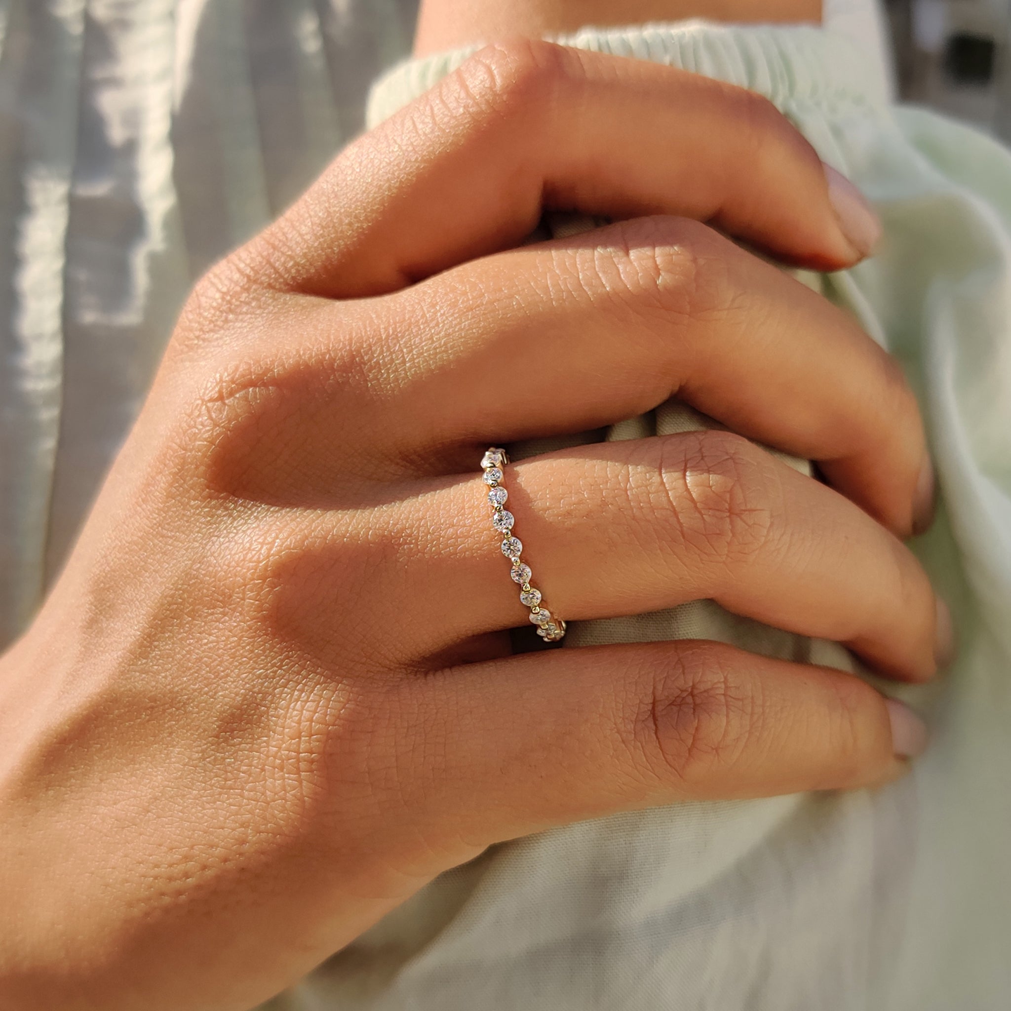 Full eternity wedding band with prong-set Moissanite for a dazzling look.