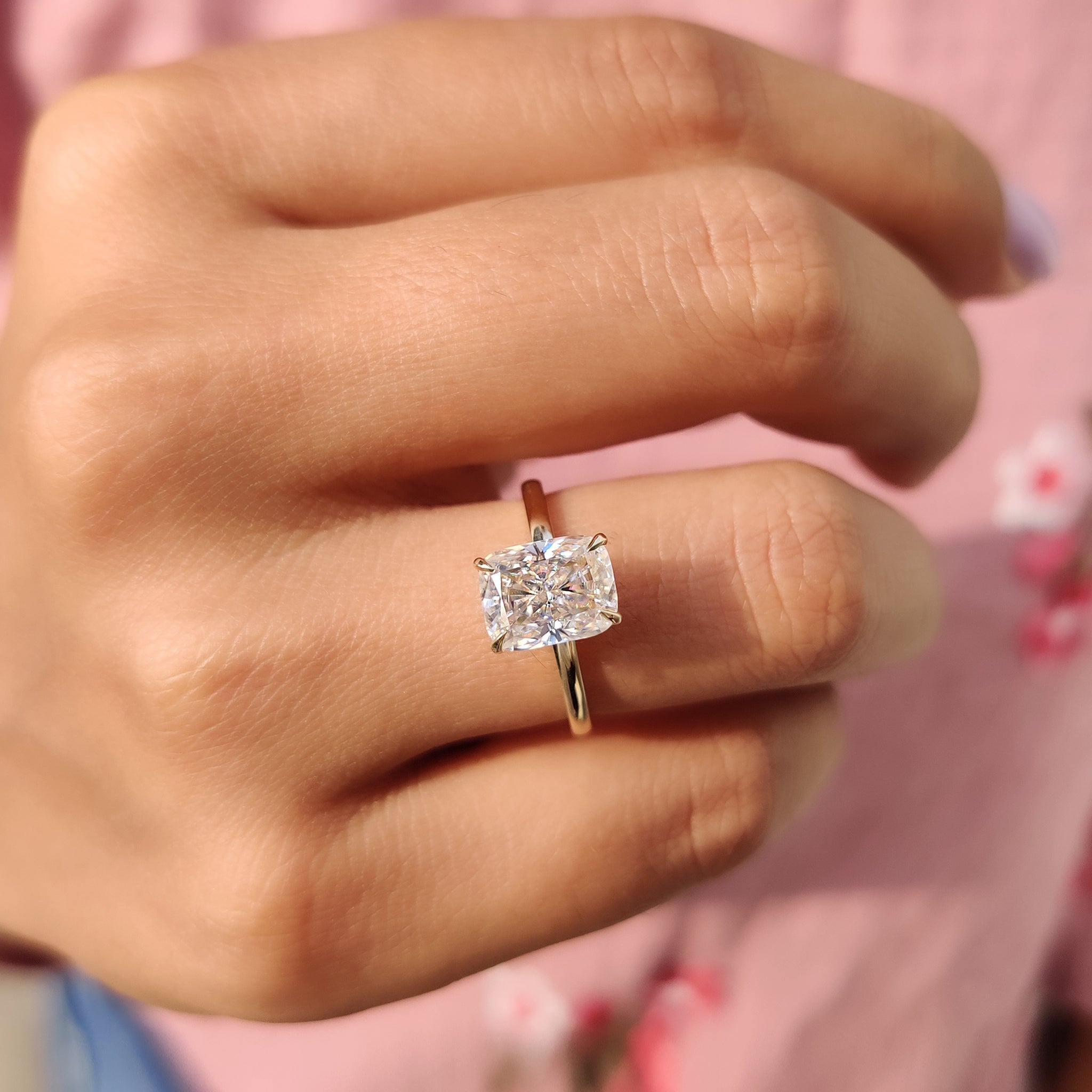 Hidden halo ring setting with cushion cut center.