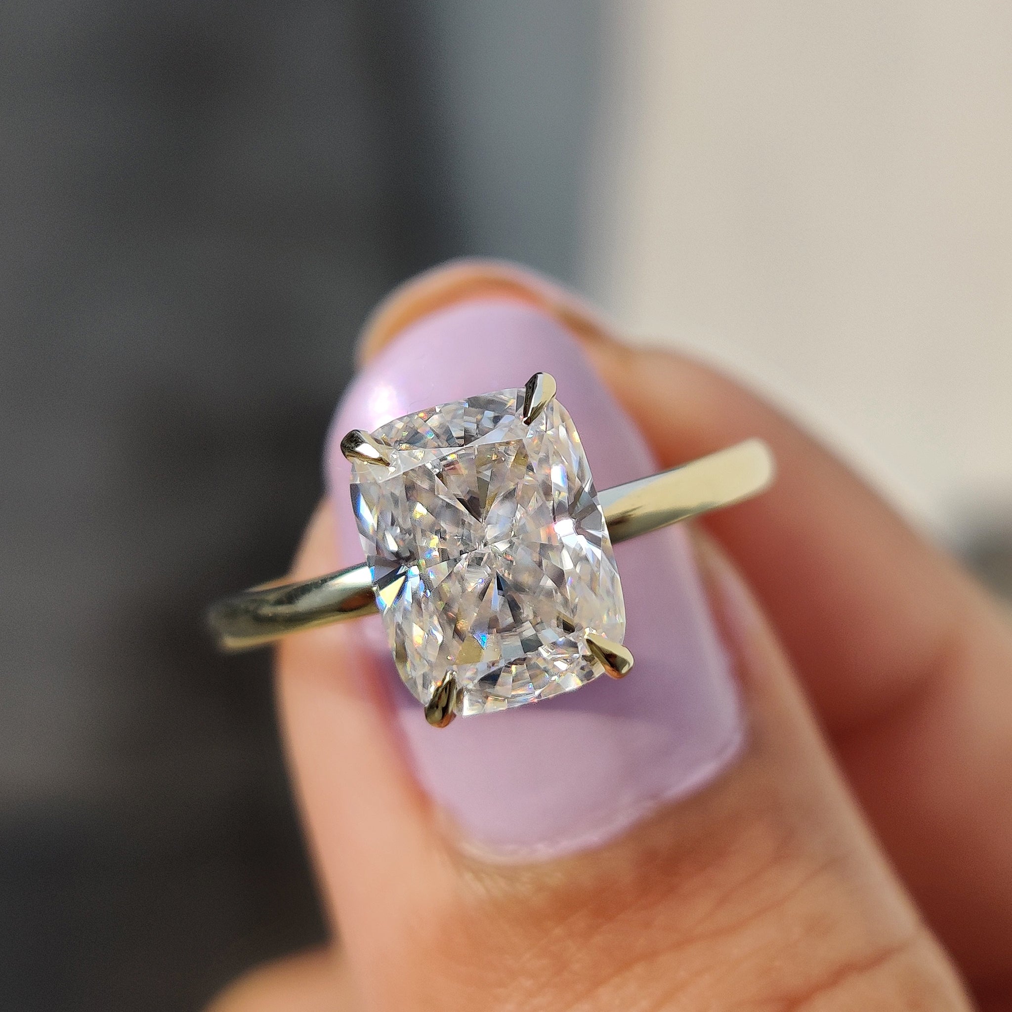 Antique cushion cut ring with hidden halo detail.