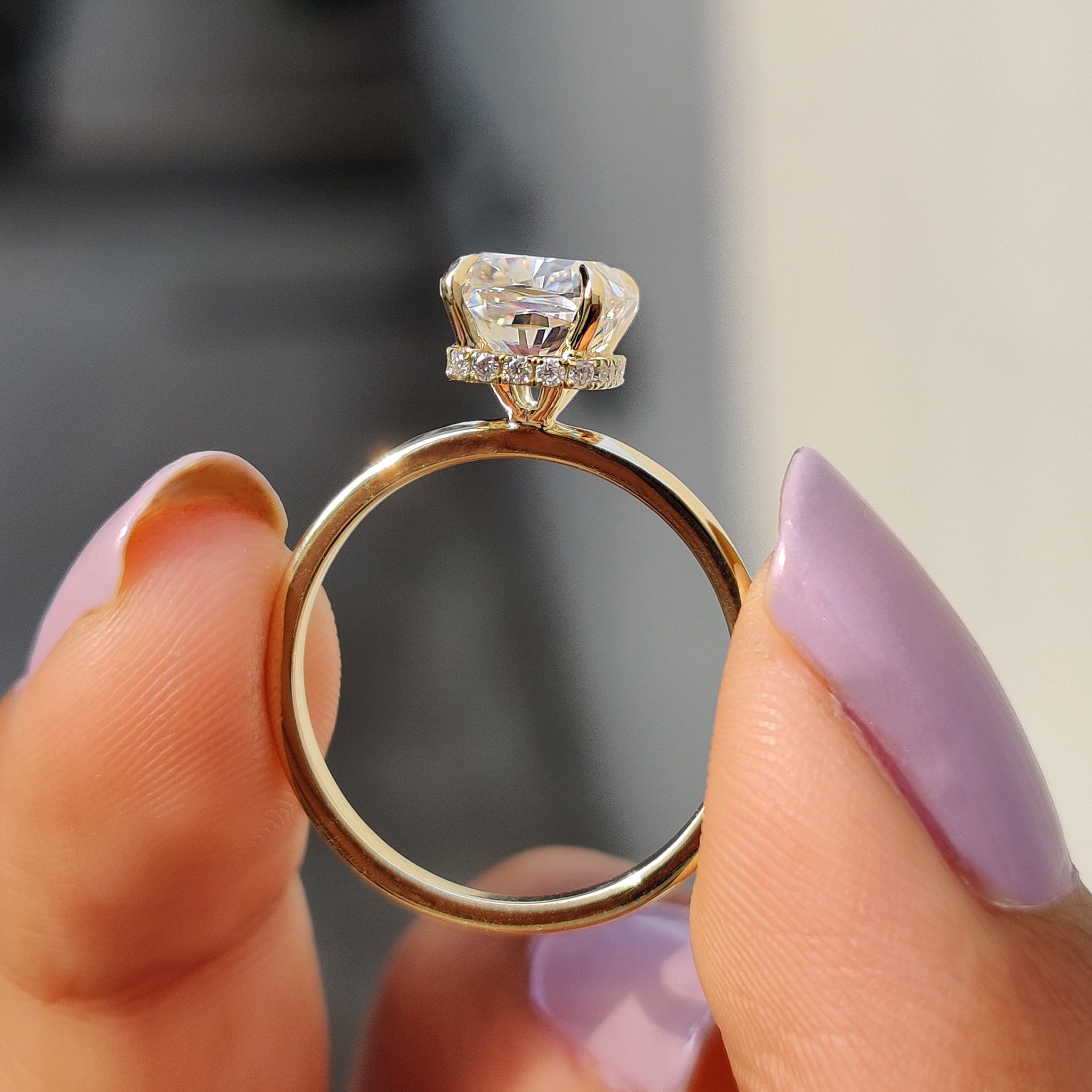 Handmade ring with cushion and hidden halo.