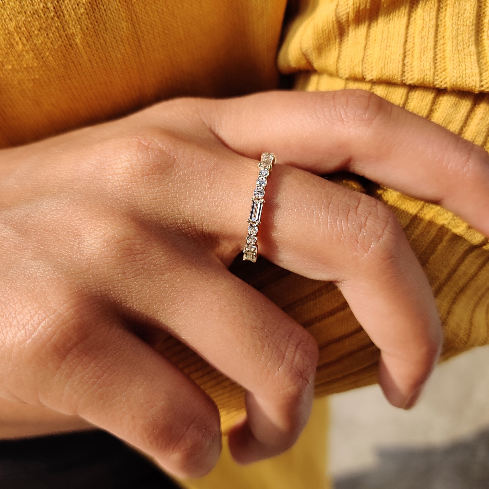 Yellow gold moissanite band paired with a prong set wedding band.