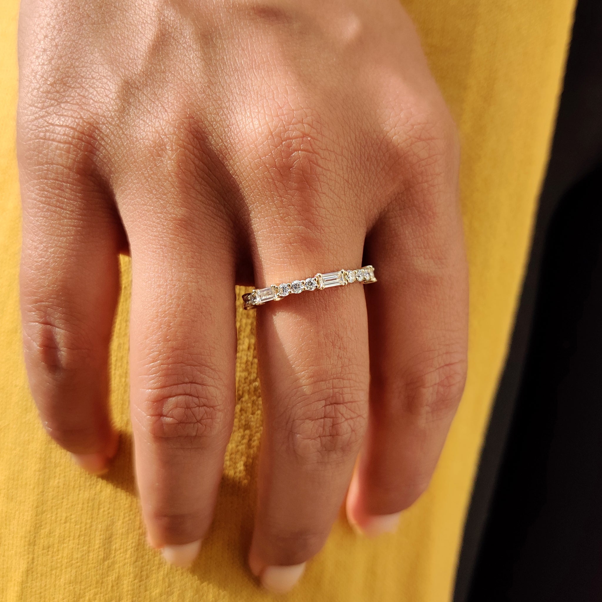 Moissanite wedding band with a baguette and round wedding band design.