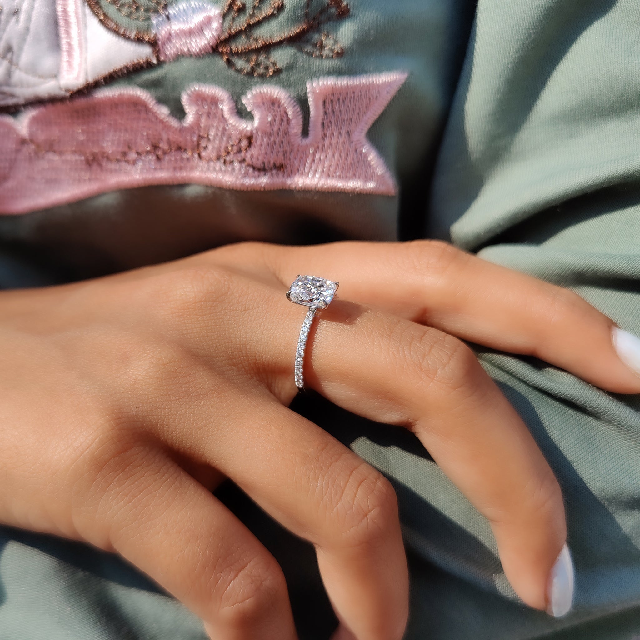 Pave setting ring with four claw prong detail.
