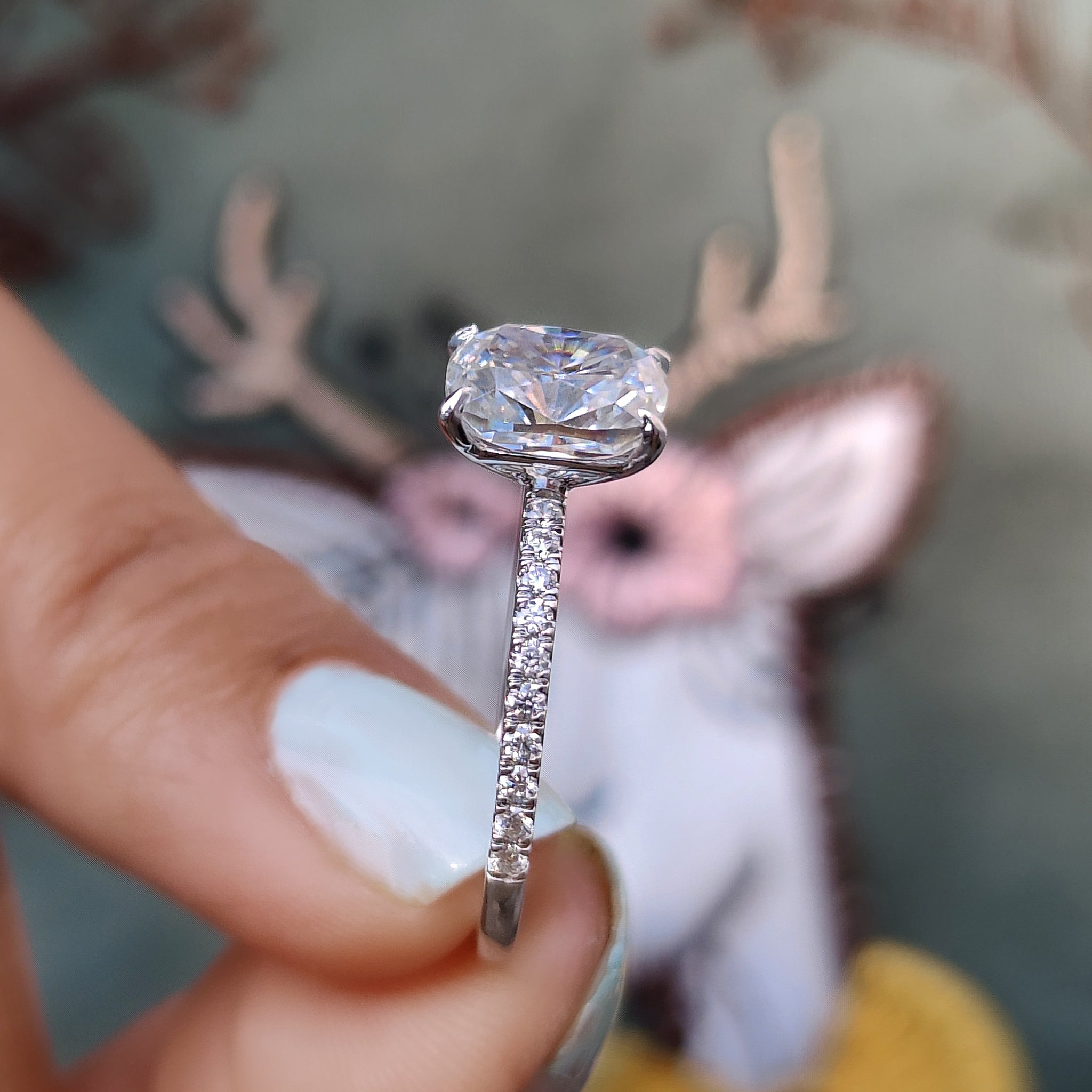 Round cut pave setting ring with cushion center.
