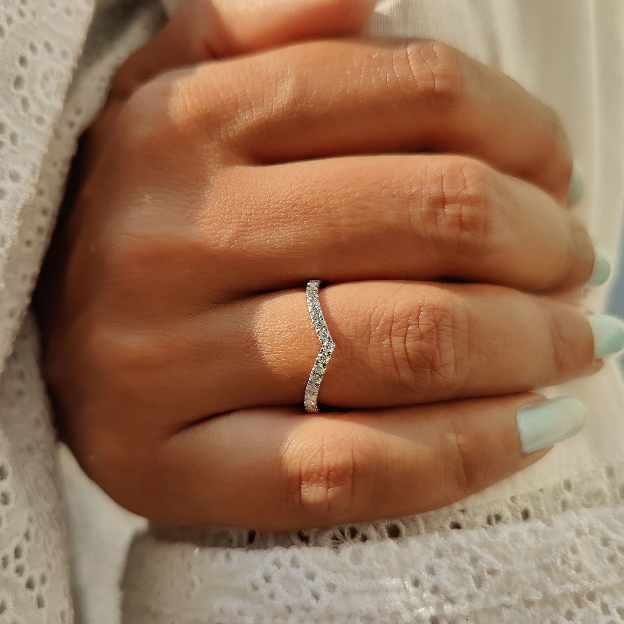 Handmade jewelry featuring moissanite wedding band.
