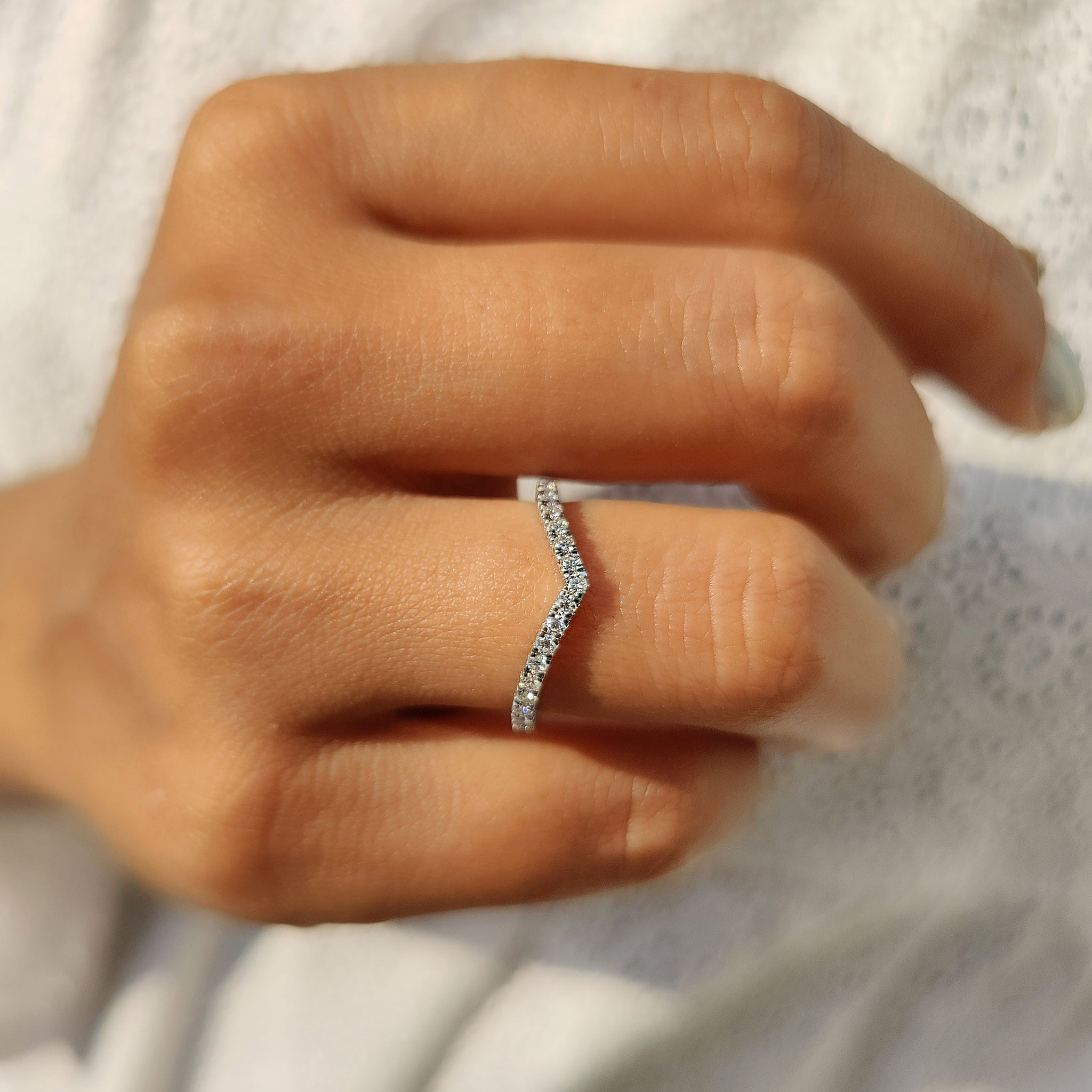 Custom moissanite band with round stones.

