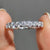 Round cut eternity band with round moissanite wedding band.