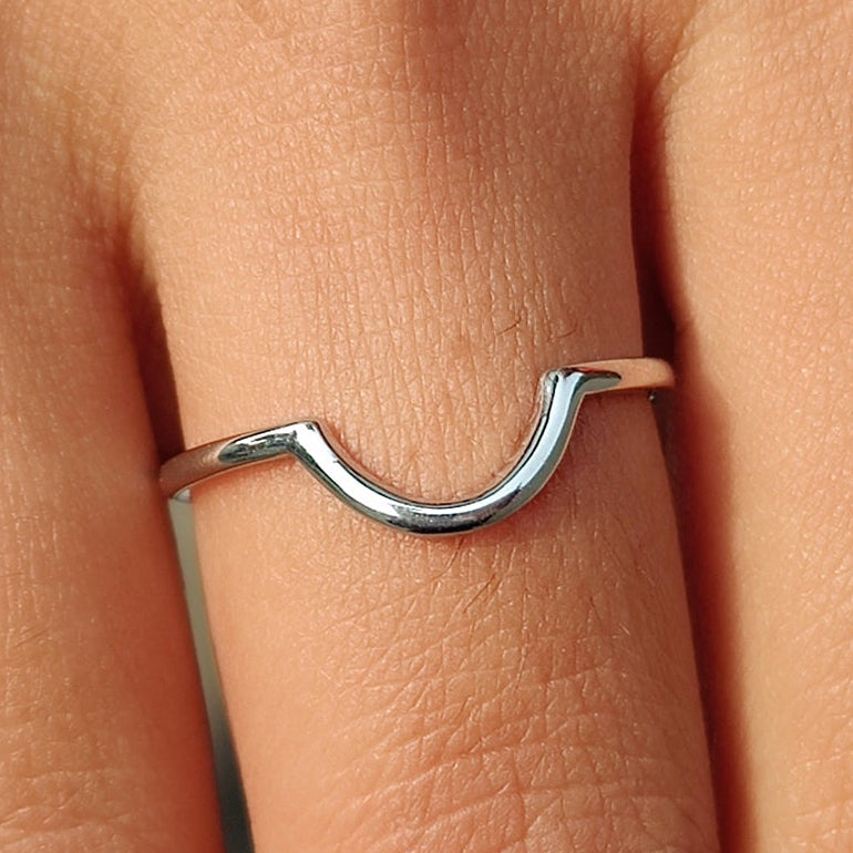 Curved wedding band white gold paired with stackable wedding band.
