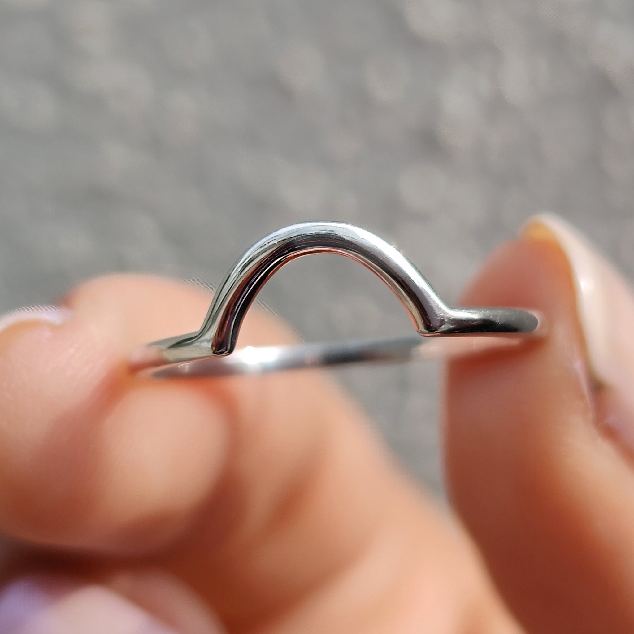 Curved wedding band white gold styled with a simple wedding band.