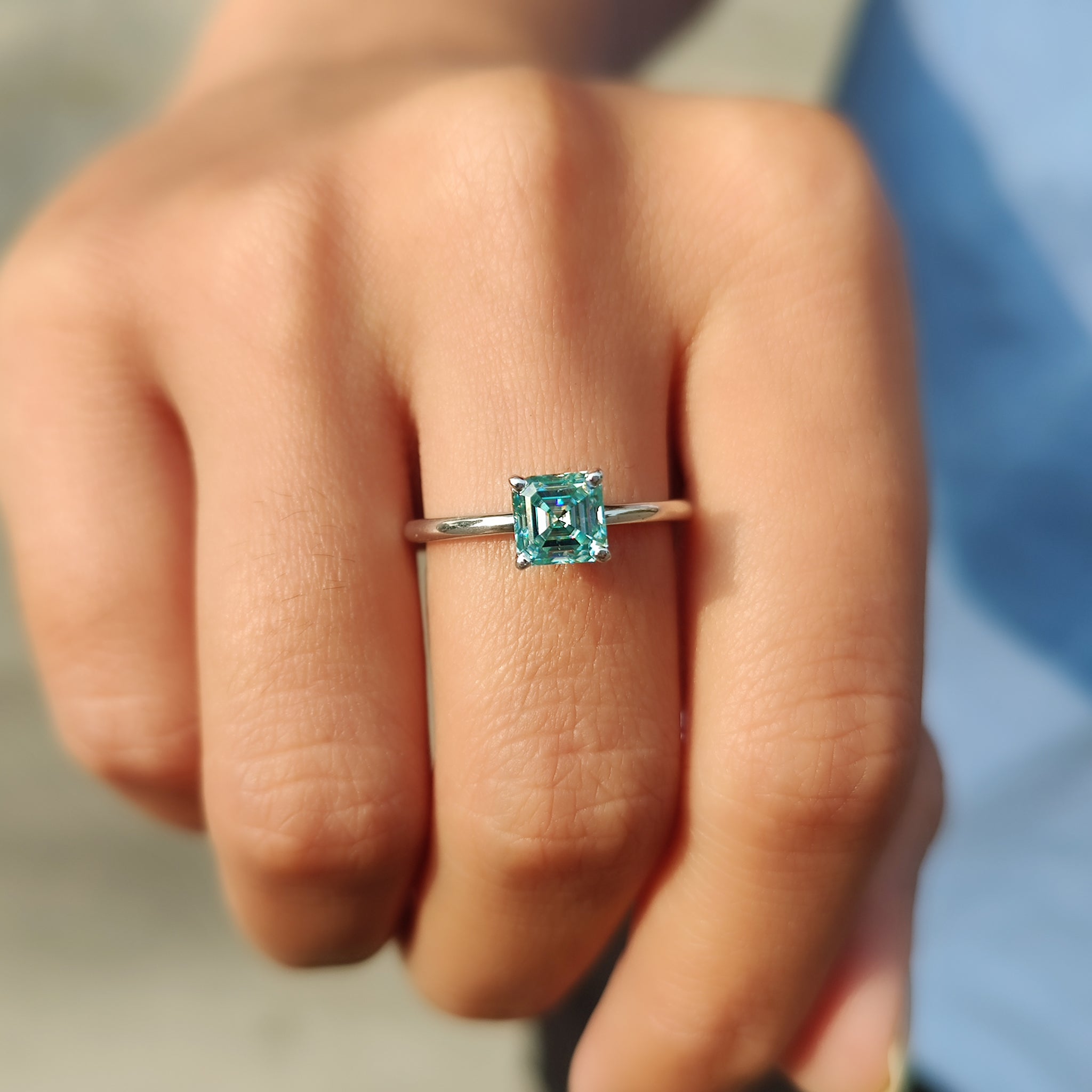 Asscher cut moissanite ring in a classic solitaire setting.