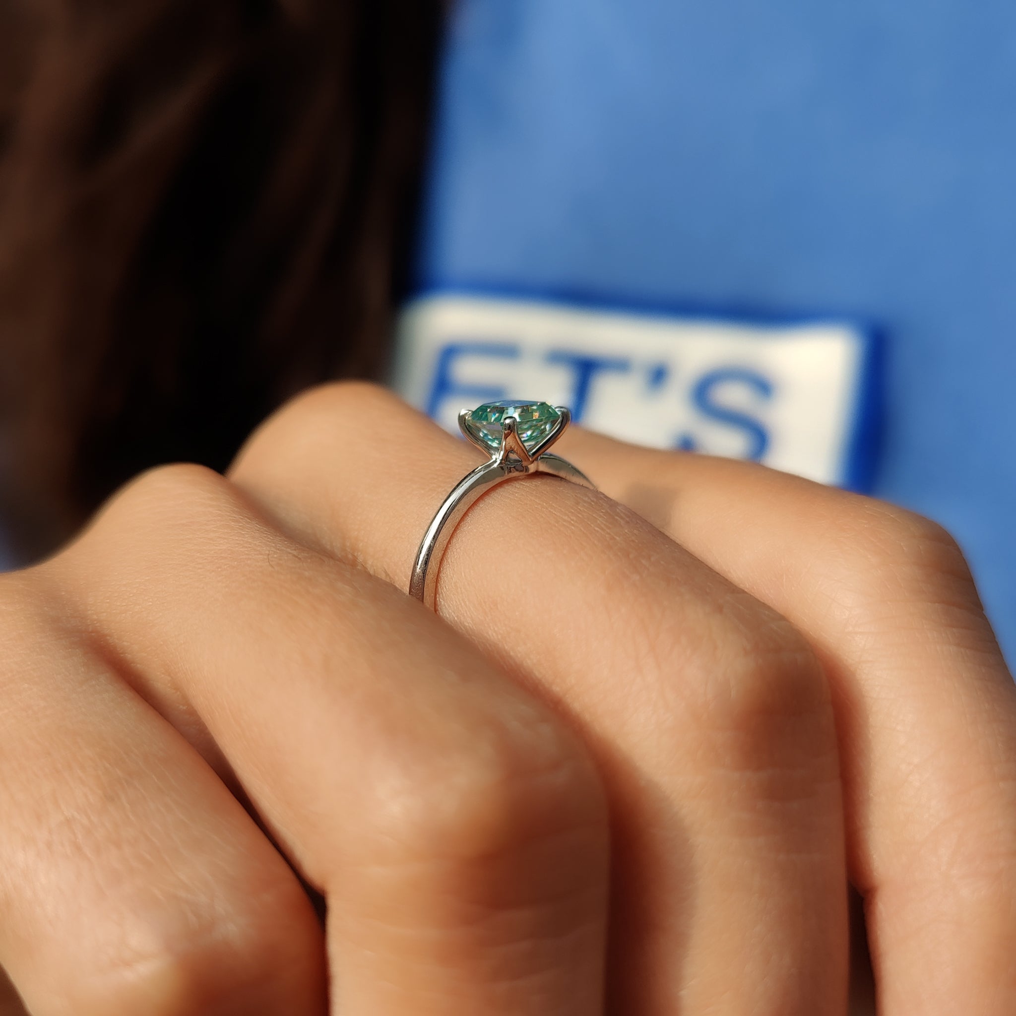 Prong setting ring with an Asscher cut moissanite.