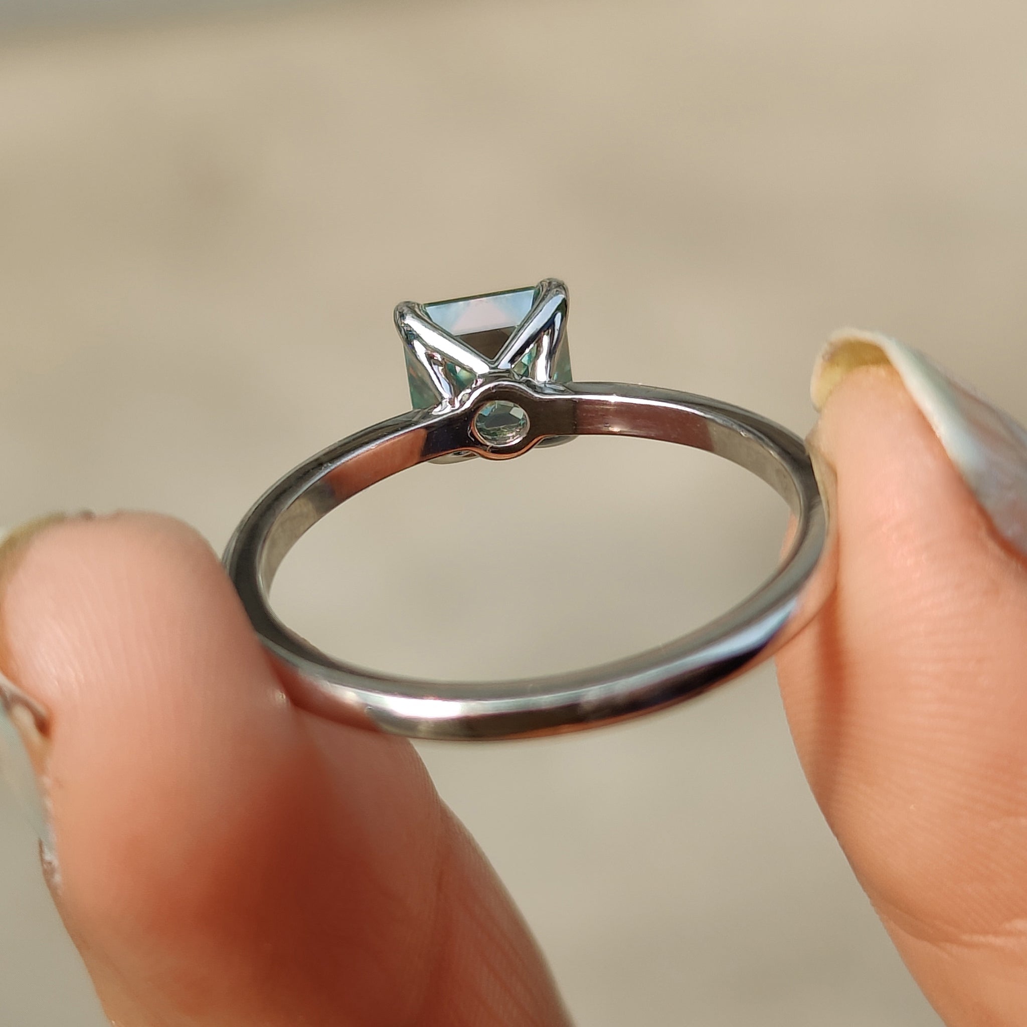 Elegant white gold ring featuring a moissanite stone.