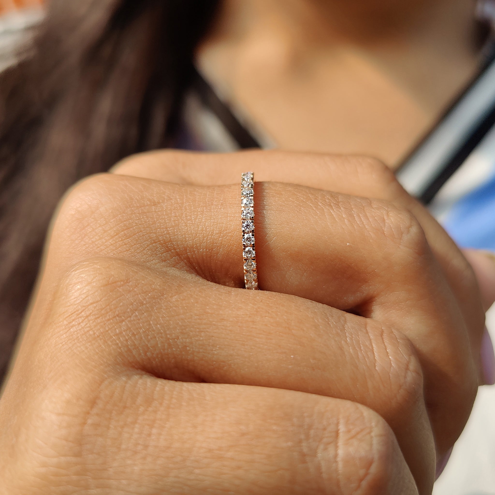 A simple wedding band and custom moissanite band complete your perfect style.
