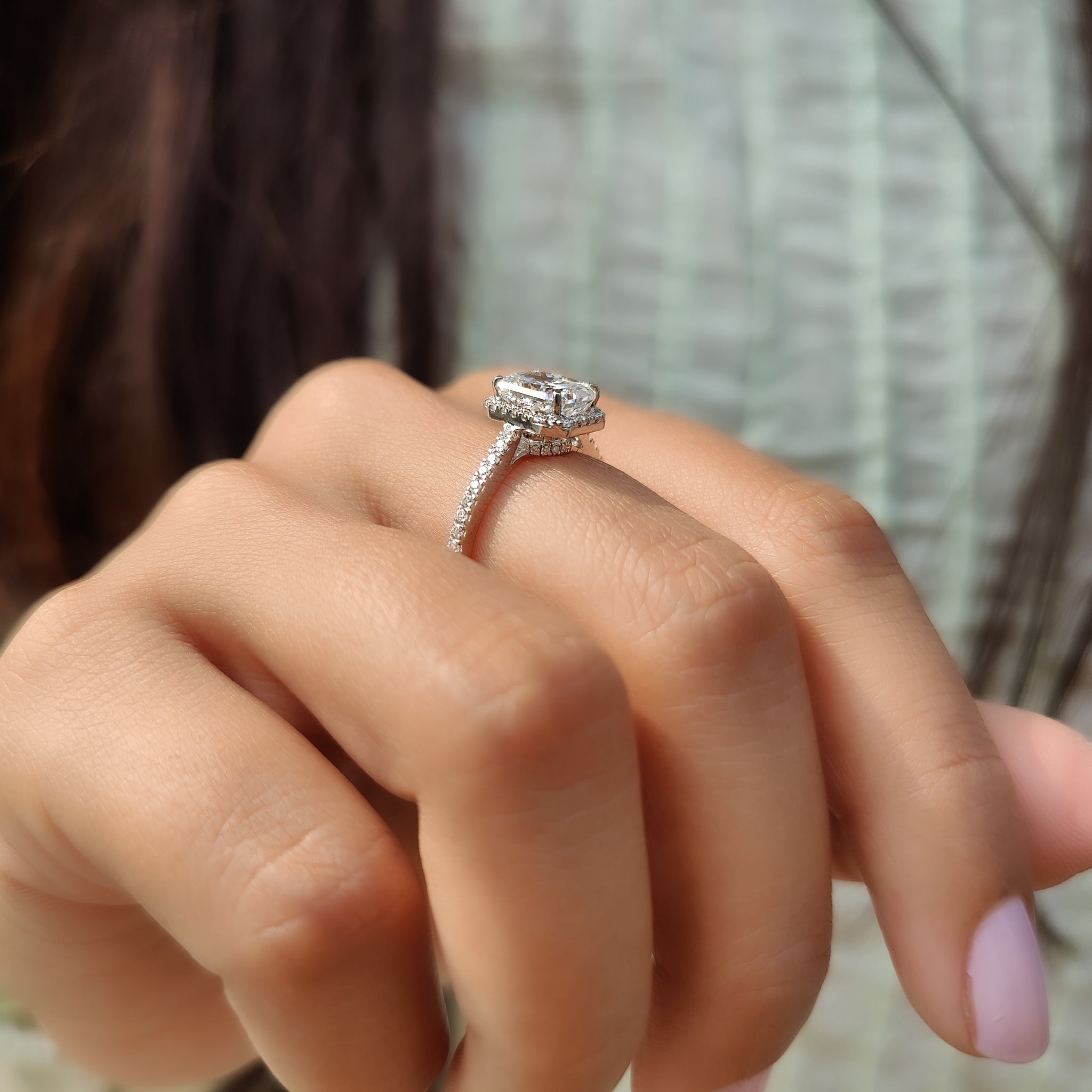 Pave band radiant cut moissanite ring with a luxurious halo setting.