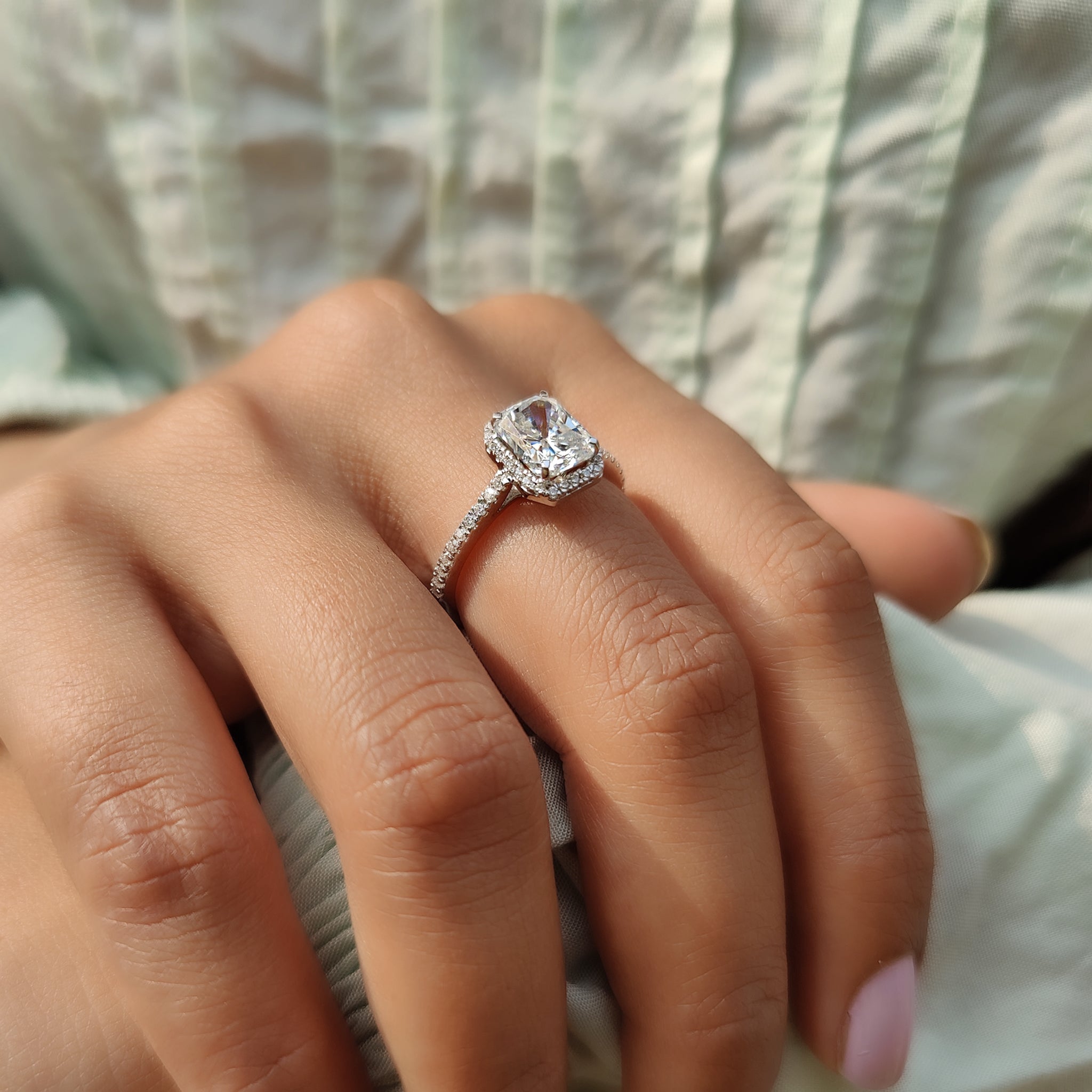 Stunning moissanite engagement ring with a hidden halo and pave band.