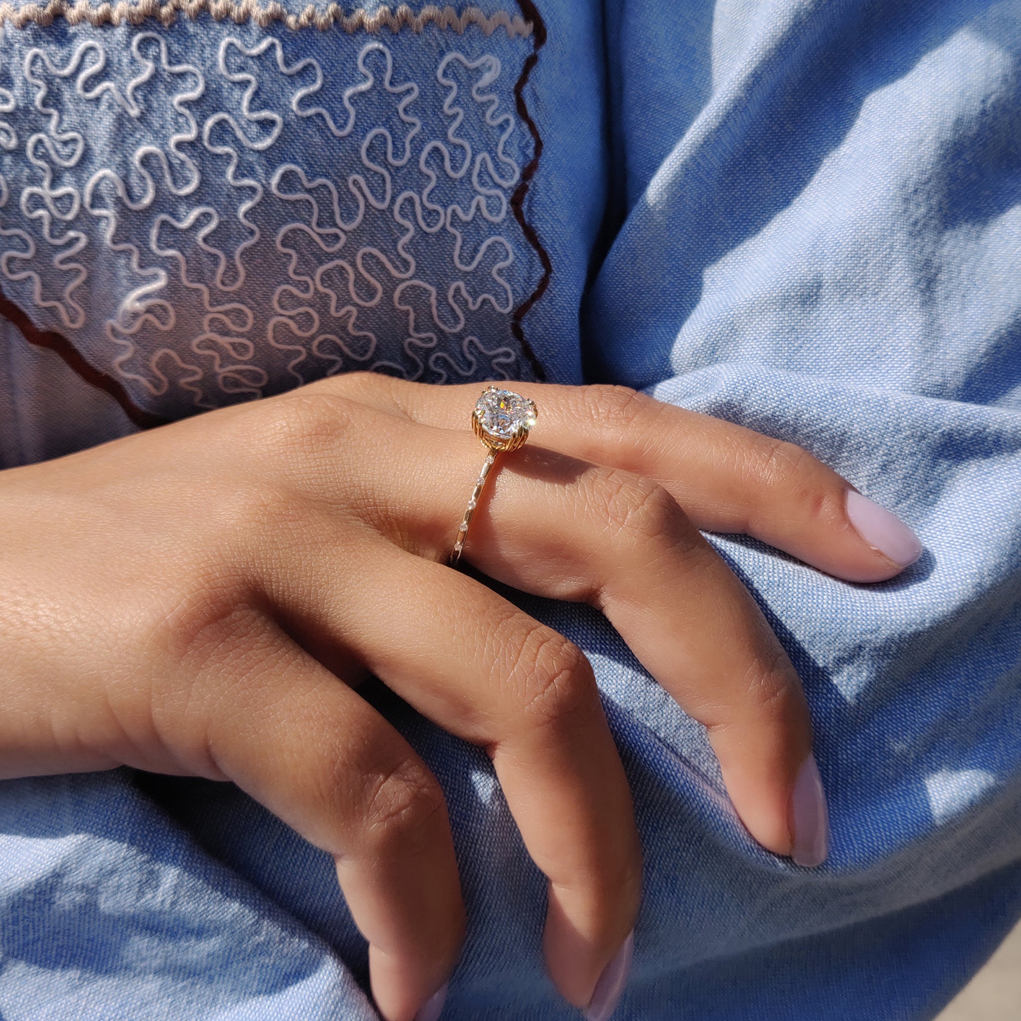 The white gold engagement ring shines with a soft glow.
