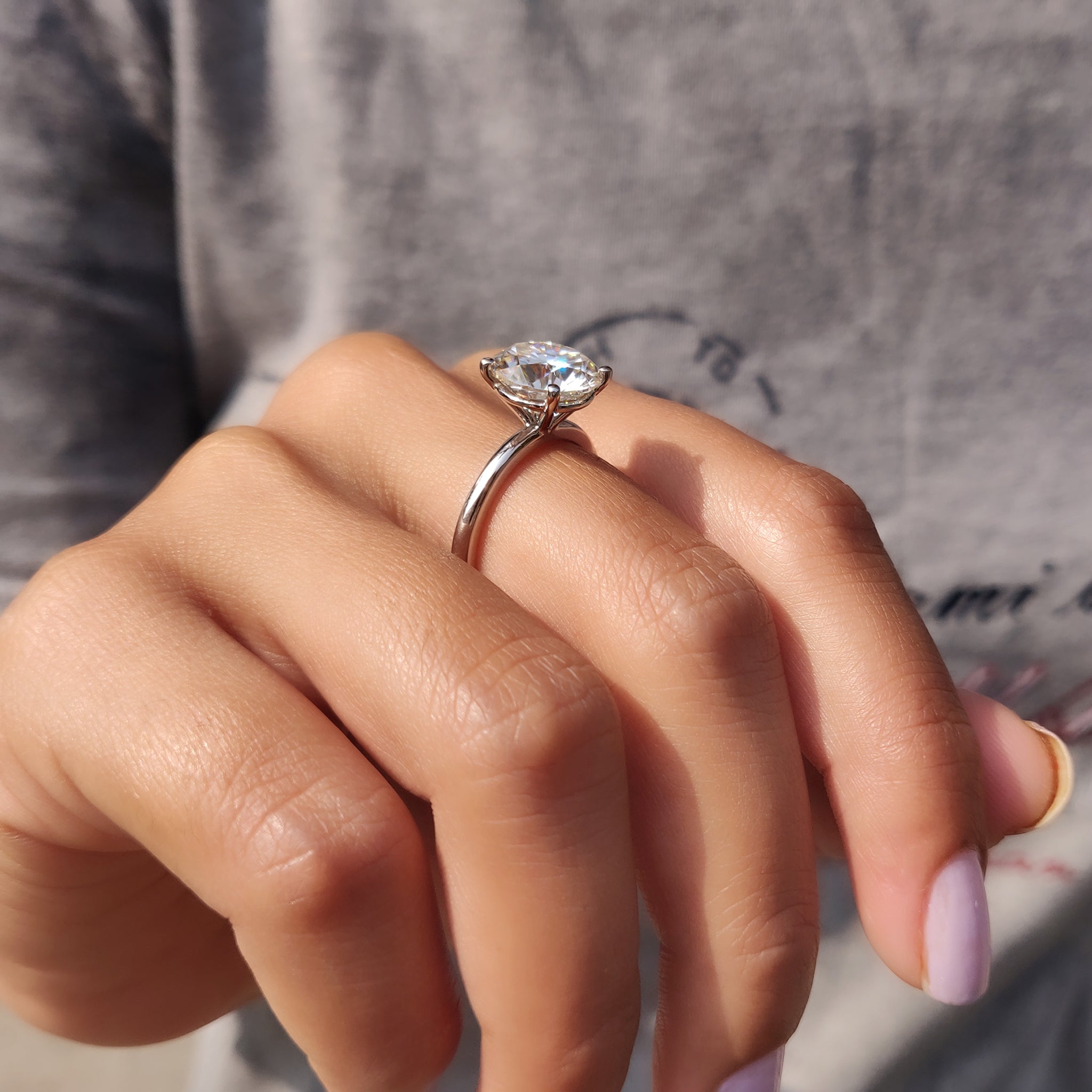 White gold engagement ring with 4 prong setting.