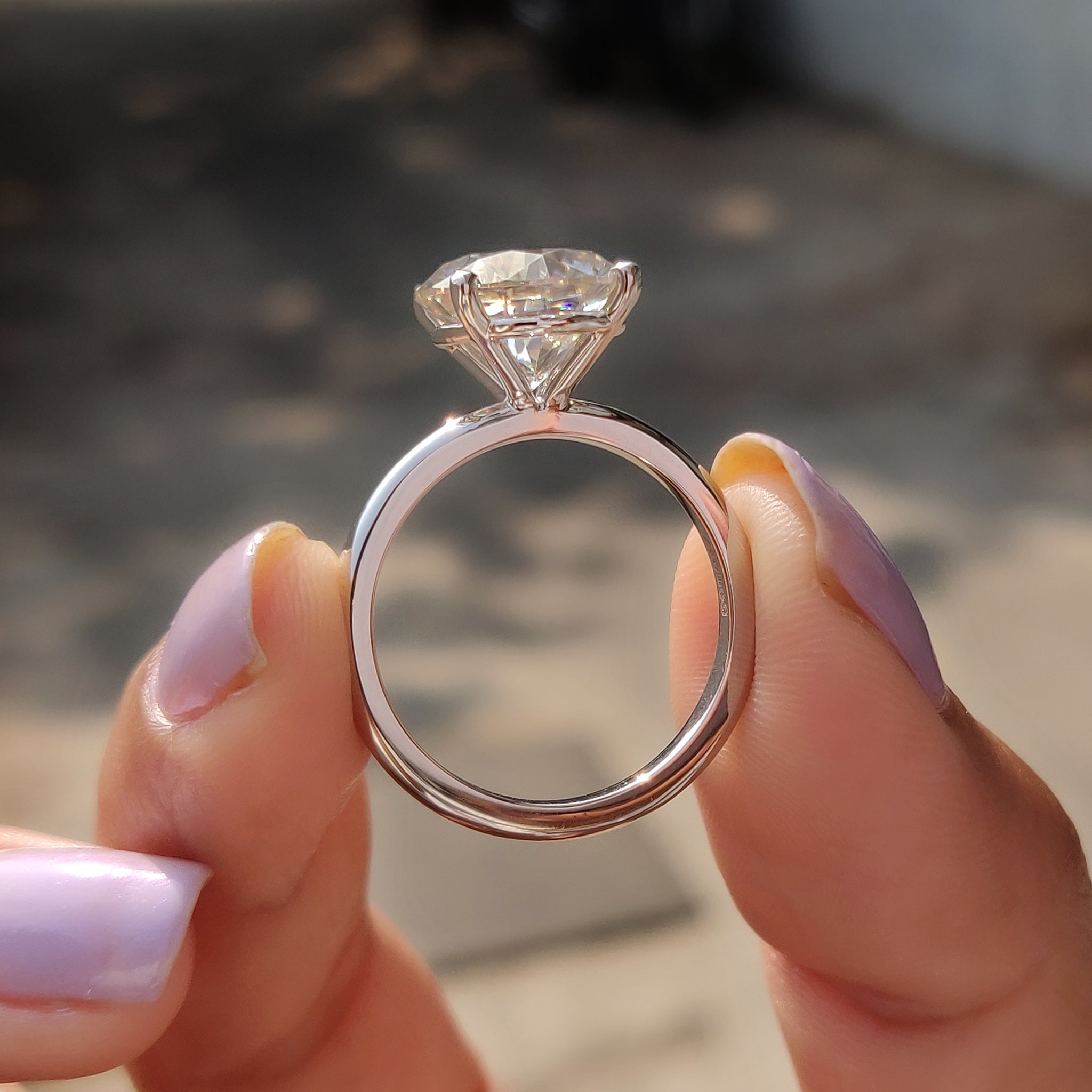 Carat Diamonds ring with white gold finish.
