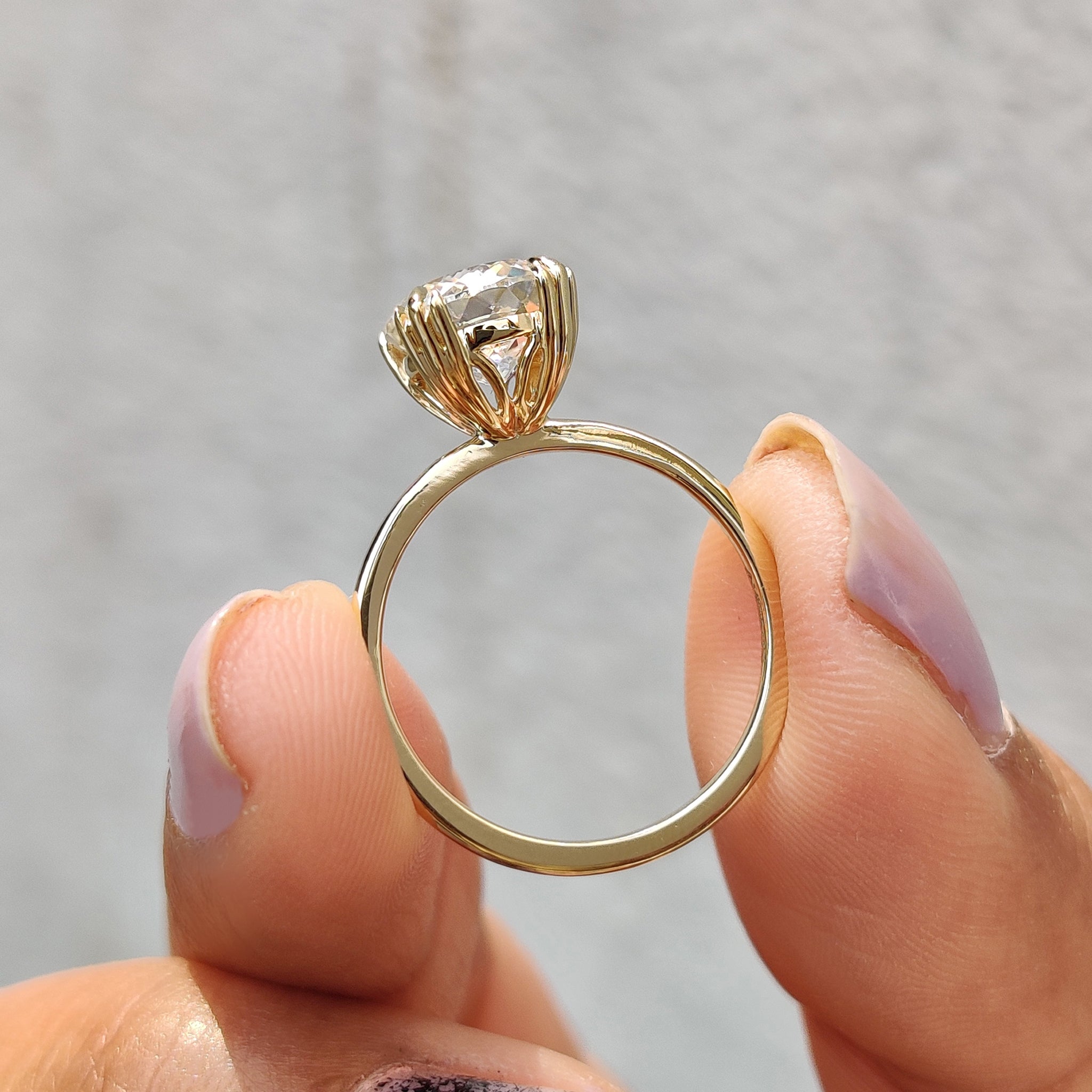 Prong setting ring featuring clean lines and a radiant center stone
