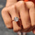 Unique engagement ring designed with asymmetrical detailing and shine
