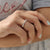 The 3/4 eternity wedding band looks gorgeous with handmade jewelry.