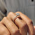 The pave setting ring highlights the stones with a seamless look.