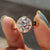 This bezel set moissanite ring offers a sleek, modern design.
