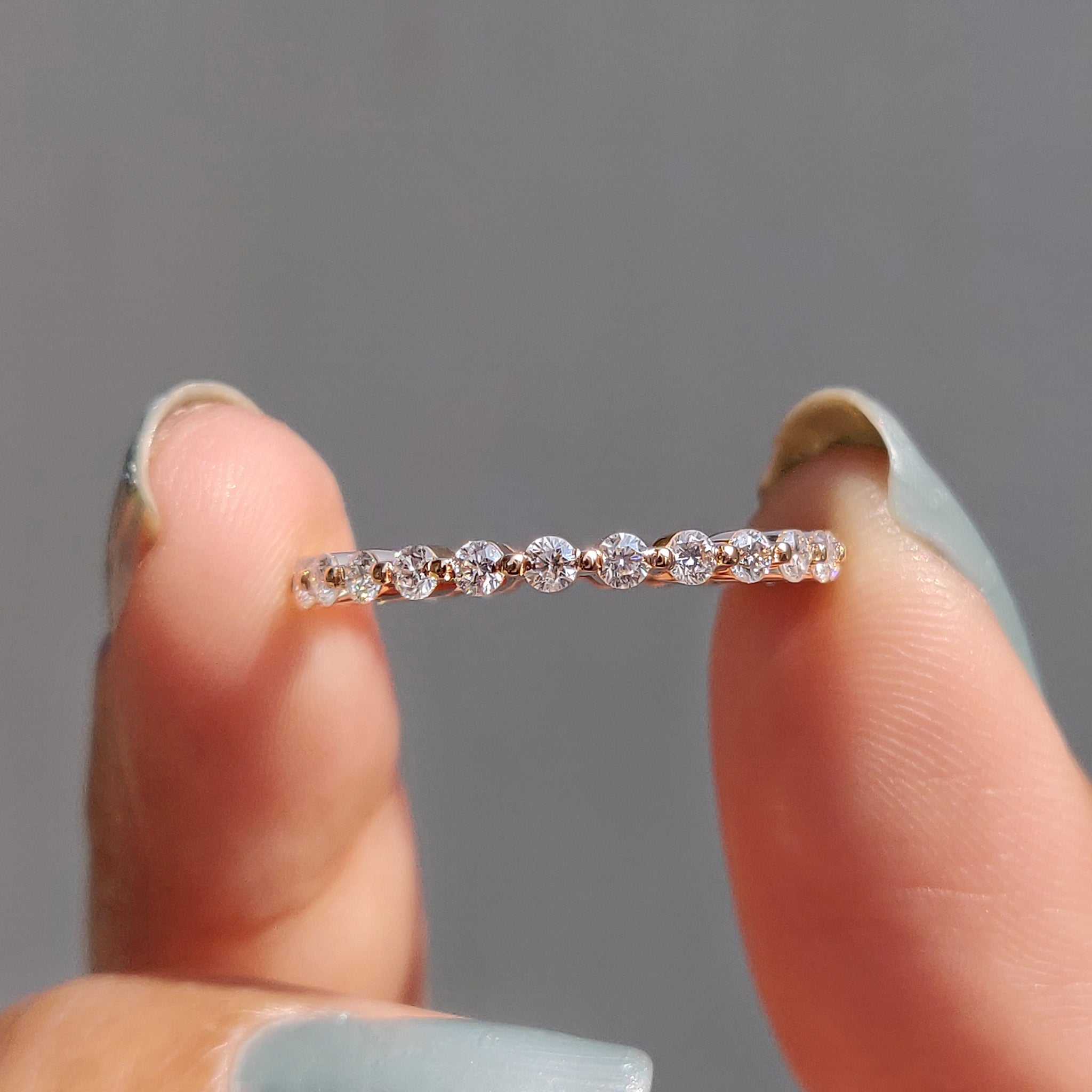 Rose gold band with diamonds, perfect for a stunning wedding or engagement ring.