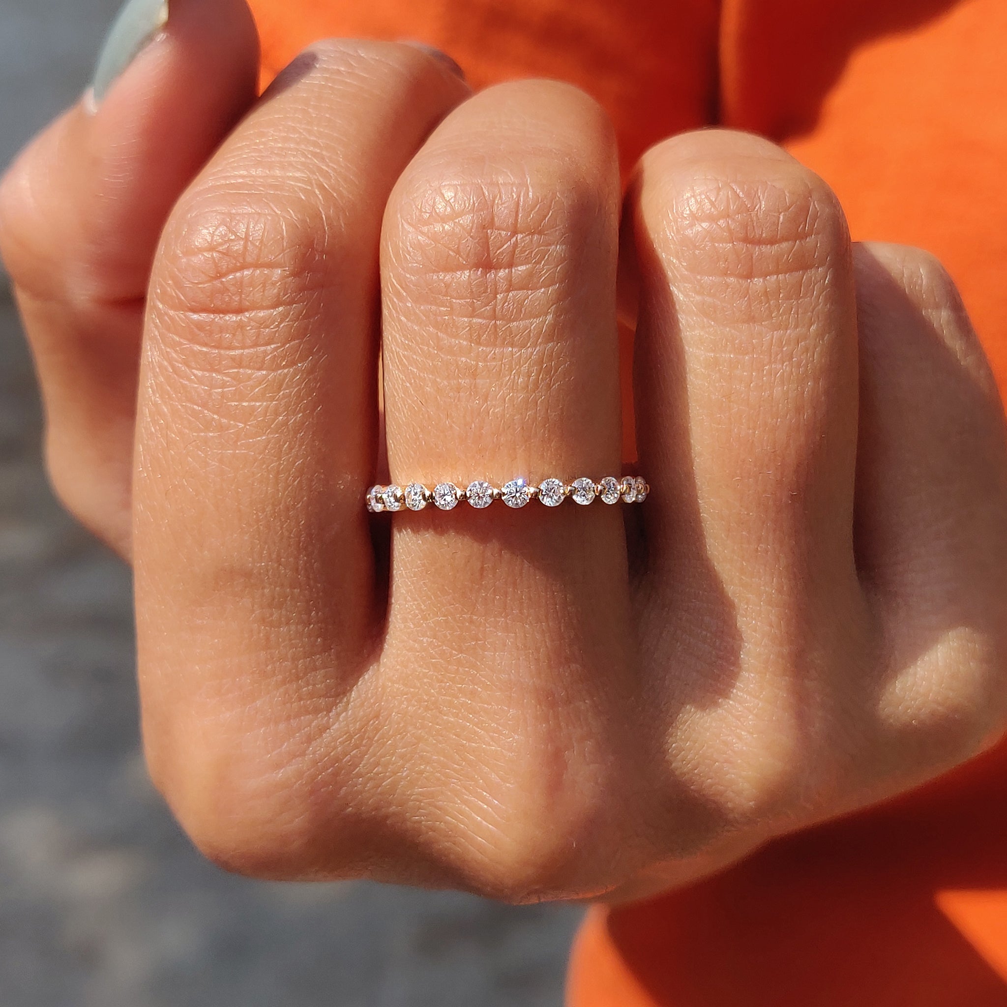 Floating bubble wedding band with delicate diamonds in a unique design.