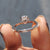 A round cut hidden halo pave setting creates a beautiful layered effect.
