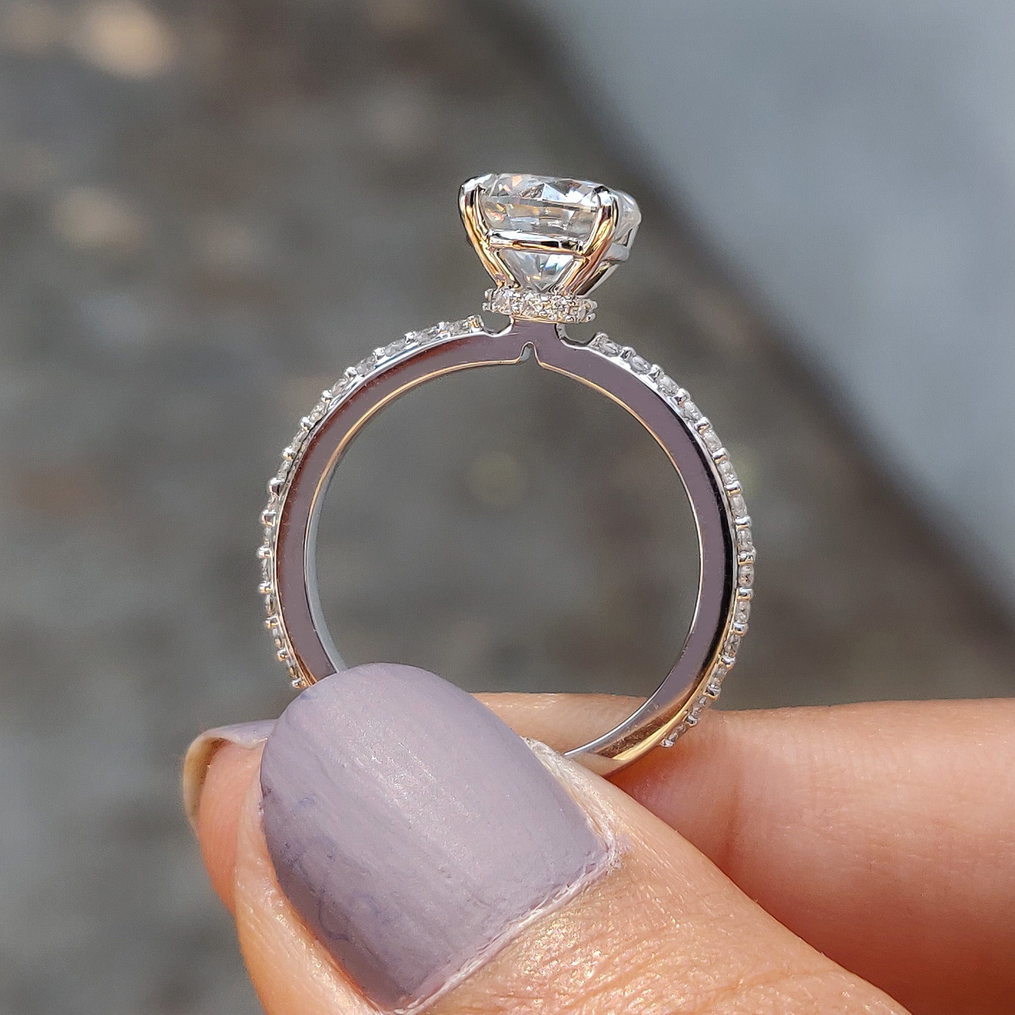 This round cut moissanite engagement ring adds timeless elegance and sparkle.
