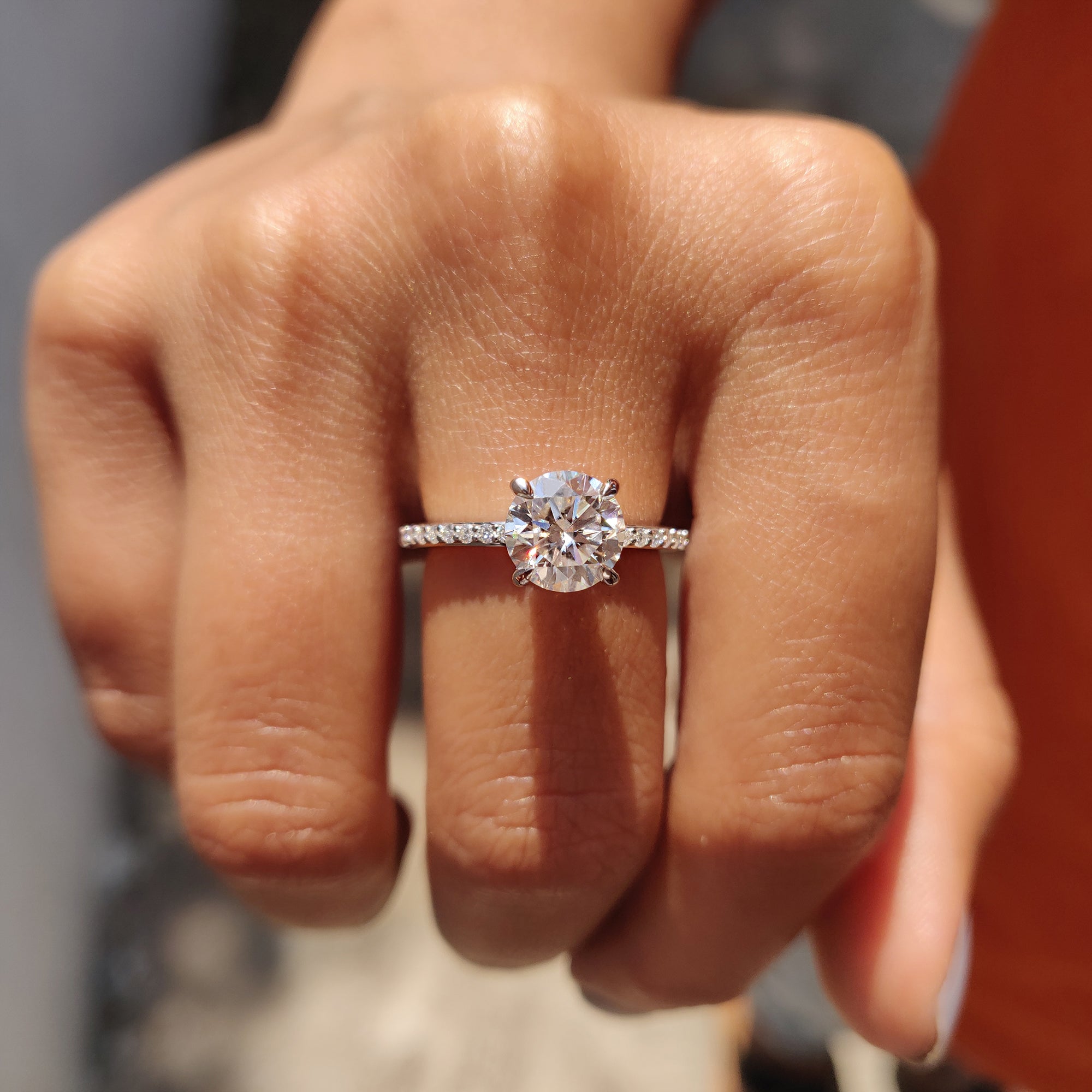 The round cut moissanite ring shines with brilliant clarity and ethical sourcing.
