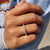 Carat Diamonds band with round cut moissanite.