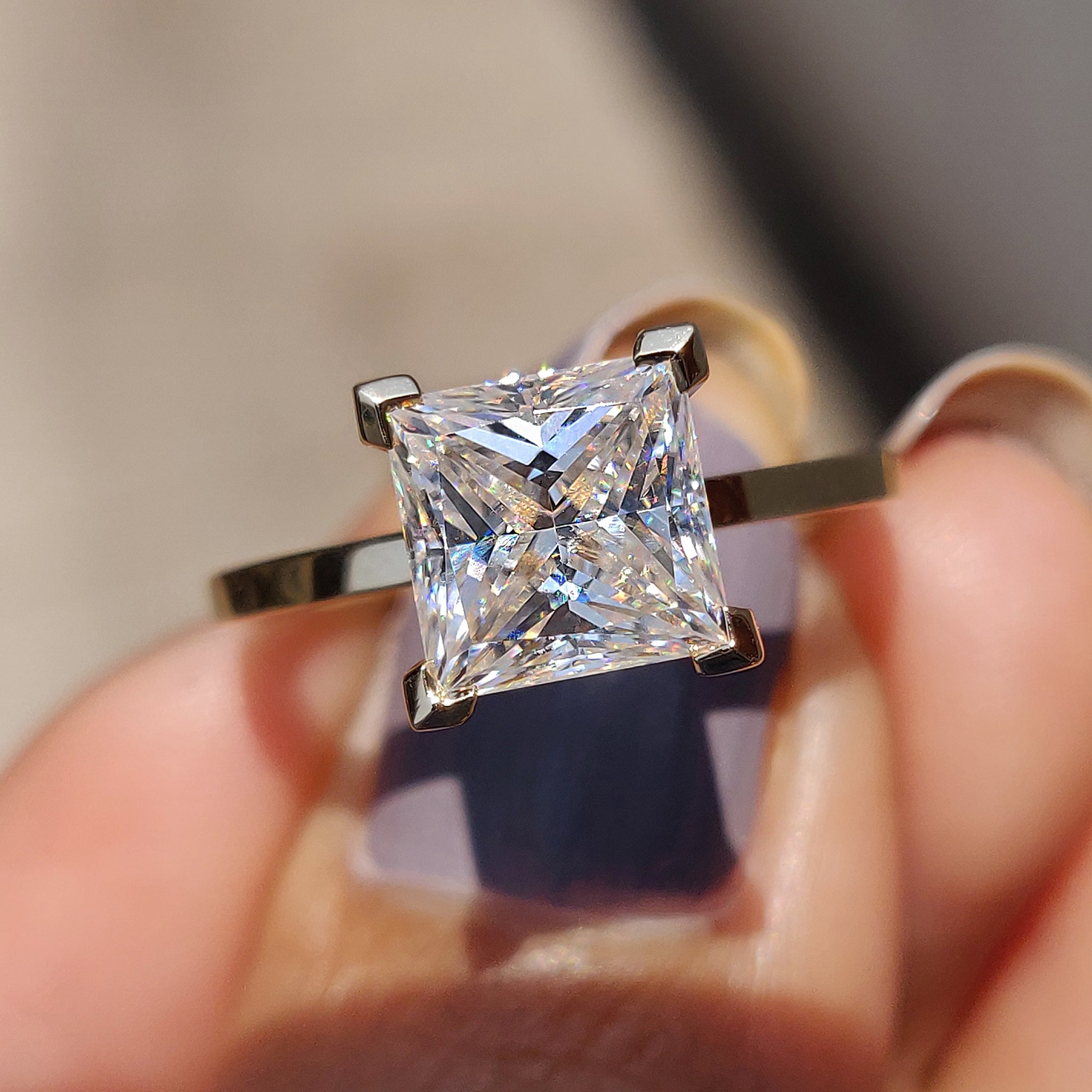This princess cut engagement ring offers a sharp, elegant design.
