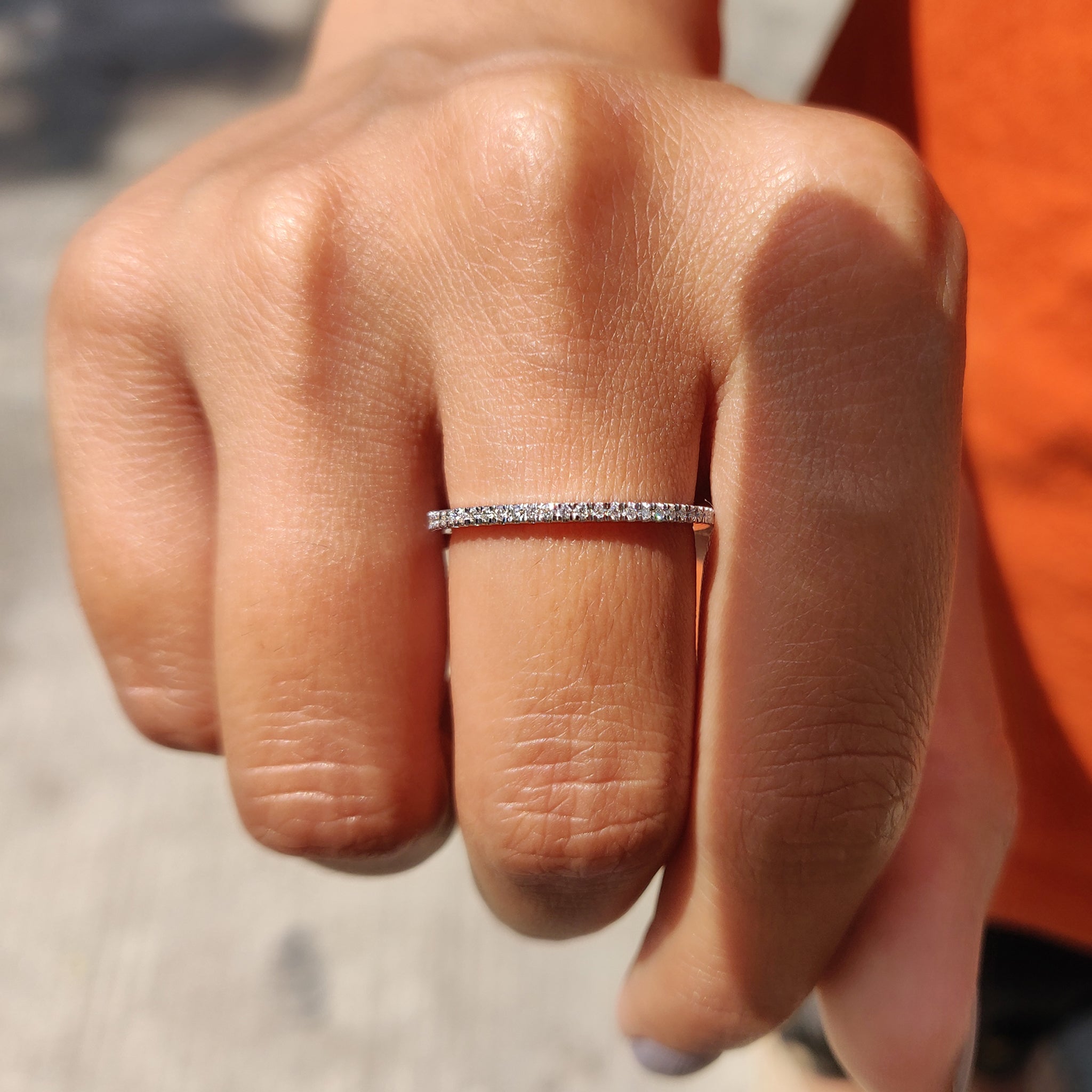 Full eternity band with round moissanite stones.