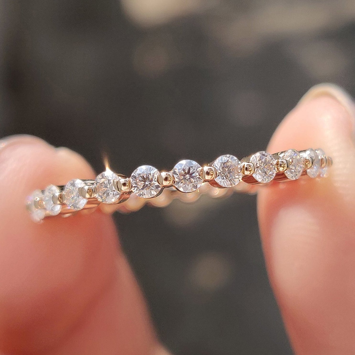 Rose gold eternity band with sparkling diamonds for a classic look.