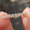 Rose gold eternity band with sparkling diamonds for a classic look.